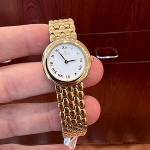 Movado Watch Gold with White Roman Numeral Dial